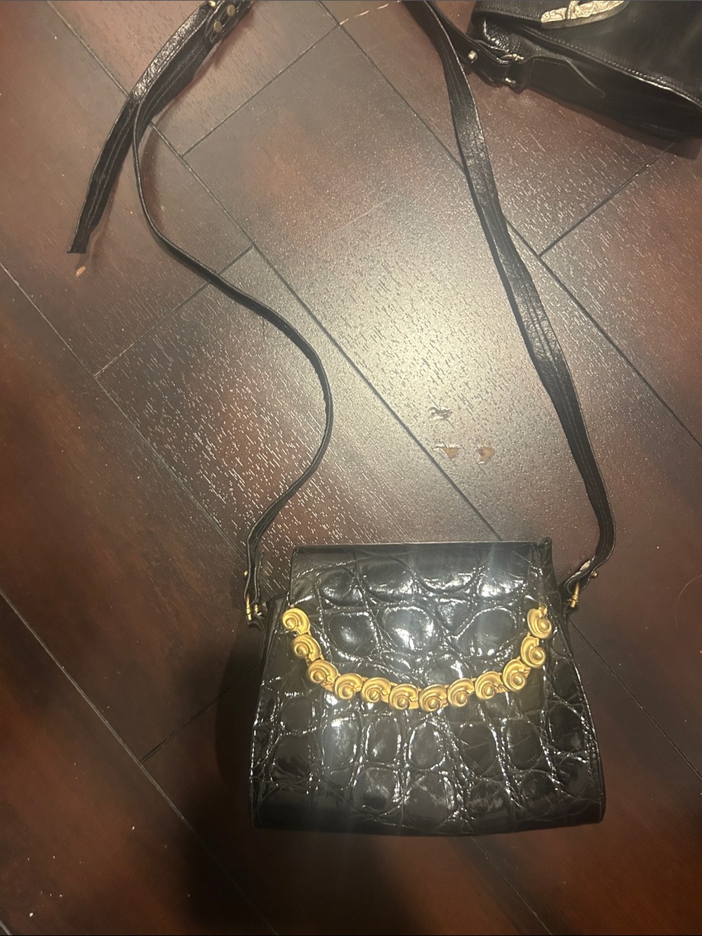 Ann Turk. -Embossed Black patten purse with Gold Rosette Trim pattens leather